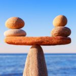 image of small stones balanced on a larger stone