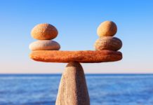 image of small stones balanced on a larger stone