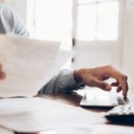 image of worker handling invoicing files