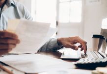 image of worker handling invoicing files